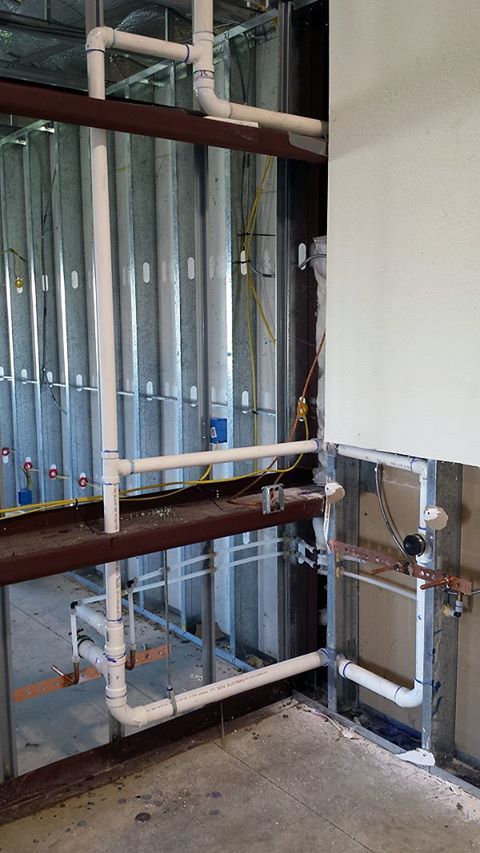 Waste pipework roughed in behind stud walls